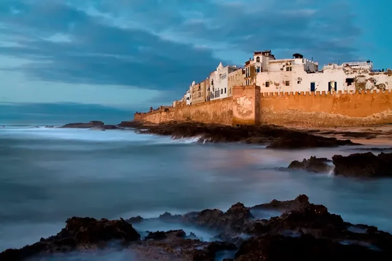 Embark on an unforgettable journey from Marrakech to Essaouira, the enchanting "pearl of the Atlantic" and historically known as Mogador. This coastal city invites you to explore its laid-back atmosphere, rich historical heritage, and stunning beaches. The Excursion from Marrakech to Essaouira 2025 offers the perfect blend of history, culture, and natural beauty. After breakfast, you’ll depart from Marrakech and make your way to Essaouira. Your adventure begins at the port, one of the city’s most lively spots, primarily dedicated to fishing. Here, you’ll witness the hustle and bustle of daily life as fishermen bring in their fresh catch. Enter the city through the Marina Gate and head towards the Sqala of the Port, where a short climb up the staircase leads to stunning views from the top of the old city walls. The tour continues along the Sqala of the Kasbah, offering even more breathtaking views of the Atlantic Ocean. Next, dive into the heart of Essaouira’s souk and market, a maze of charming alleys filled with artisans selling traditional Moroccan crafts, spices, and souvenirs. In the afternoon, you’ll have free time to relax or continue exploring the city. Stroll along the beautiful beach, which stretches as far as the eye can see, or enjoy a refreshing break by the sea. If the famous winds of Essaouira are strong, you may choose to further explore the city's vibrant streets or opt for a one-hour boat tour across the bay, passing near the Purple Islands. This excursion with ZagoraExperience offers a perfect opportunity to discover the historic charm of Essaouira, a city that seamlessly blends its natural beauty with its rich cultural traditions. Whether relaxing by the sea, exploring historical sites, or immersing yourself in the vibrant local life, this trip promises a memorable experience. Included in the Tour: Private transfer to and from your hotel in Marrakech in a modern 4x4 or air-conditioned van. Private Italian-speaking guide throughout the excursion. Tasting of local gastronomy in Essaouira. Not Included in the Tour: Additional meals and beverages not mentioned in the itinerary. Tips and personal expenses (optional). Excursion from Marrakech to Essaouira 2025 is just one of the many amazing travel proposals we offer to help you discover the beauty of Morocco: Desert tour from Fes Desert tour from Marrakech Desert tour from Casablanca Morocco Imperial Cities Tours Tour in Morocco 2025 15 Days Tour in Morocco Trekking Tour in Morocco (15 days) Contact us for more information and book your Essaouira excursion with ZagoraExperience to enjoy an unforgettable day by the Atlantic coast!